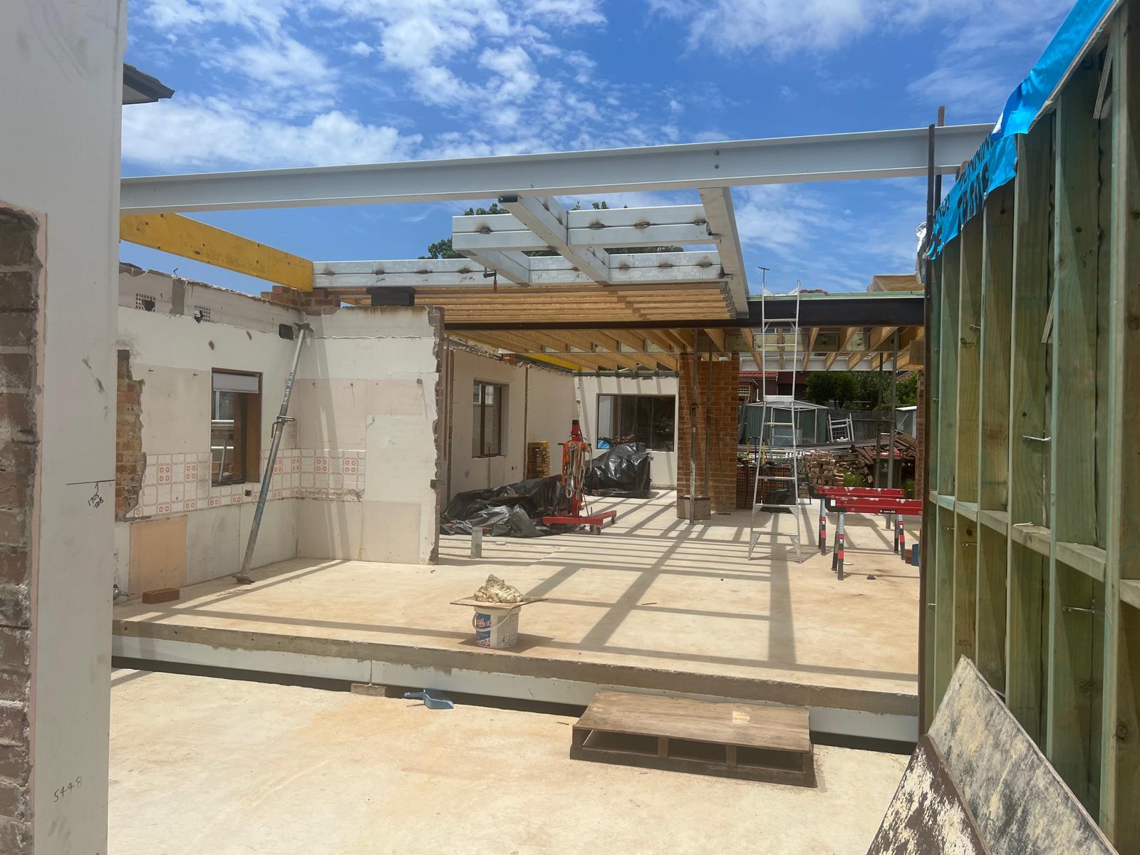 Long-span steel beam opening up the rear of the home