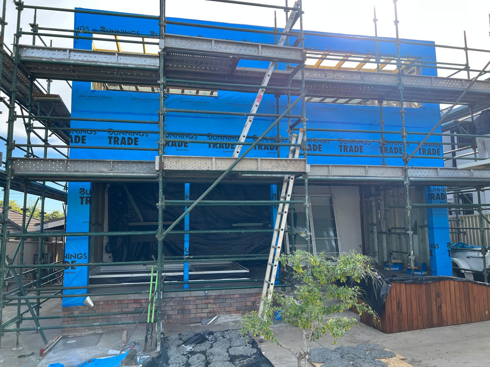 Home extension wrapped in sarking, ready for cladding