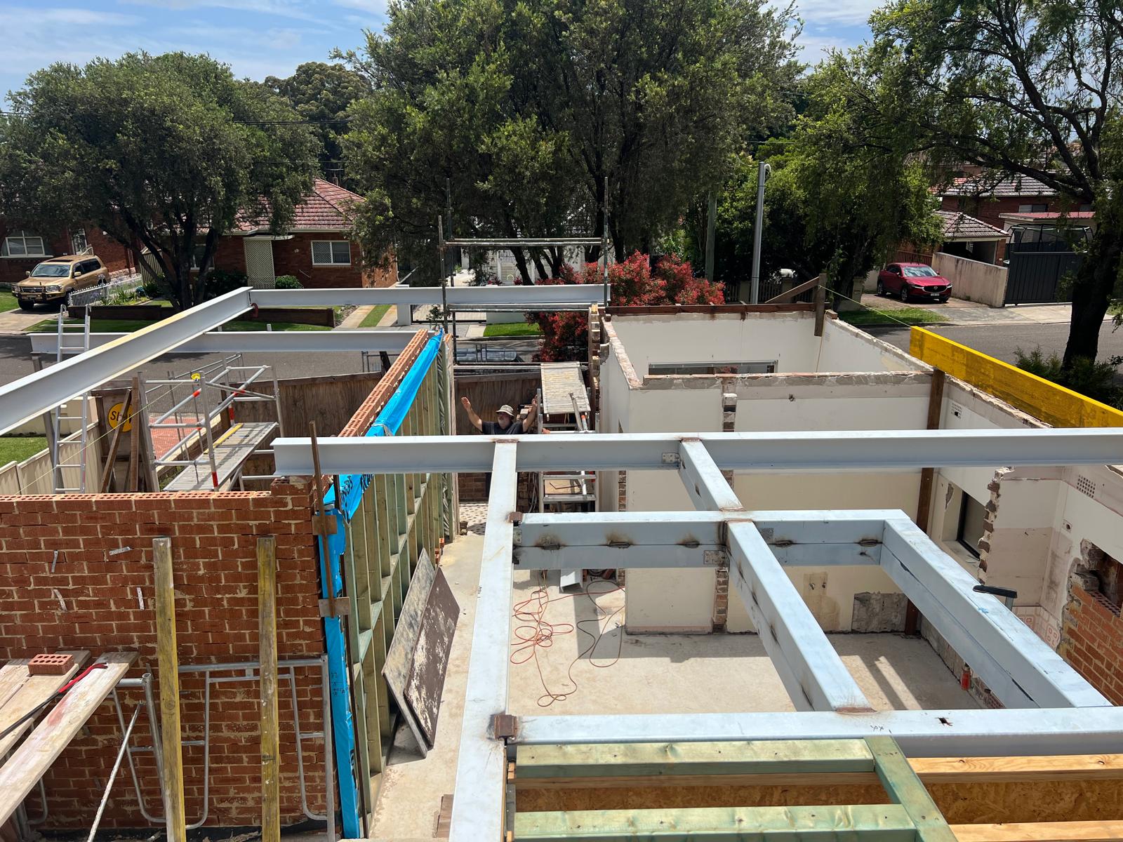 Perimeter steel beams tied into existing brickwork