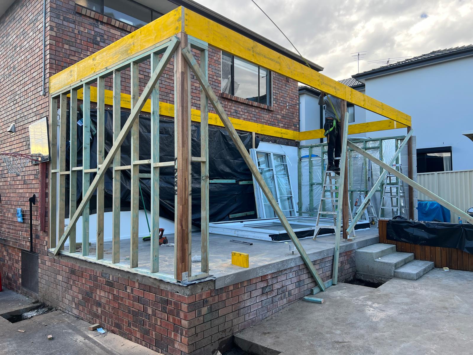 Ground-floor extension framed off existing brick