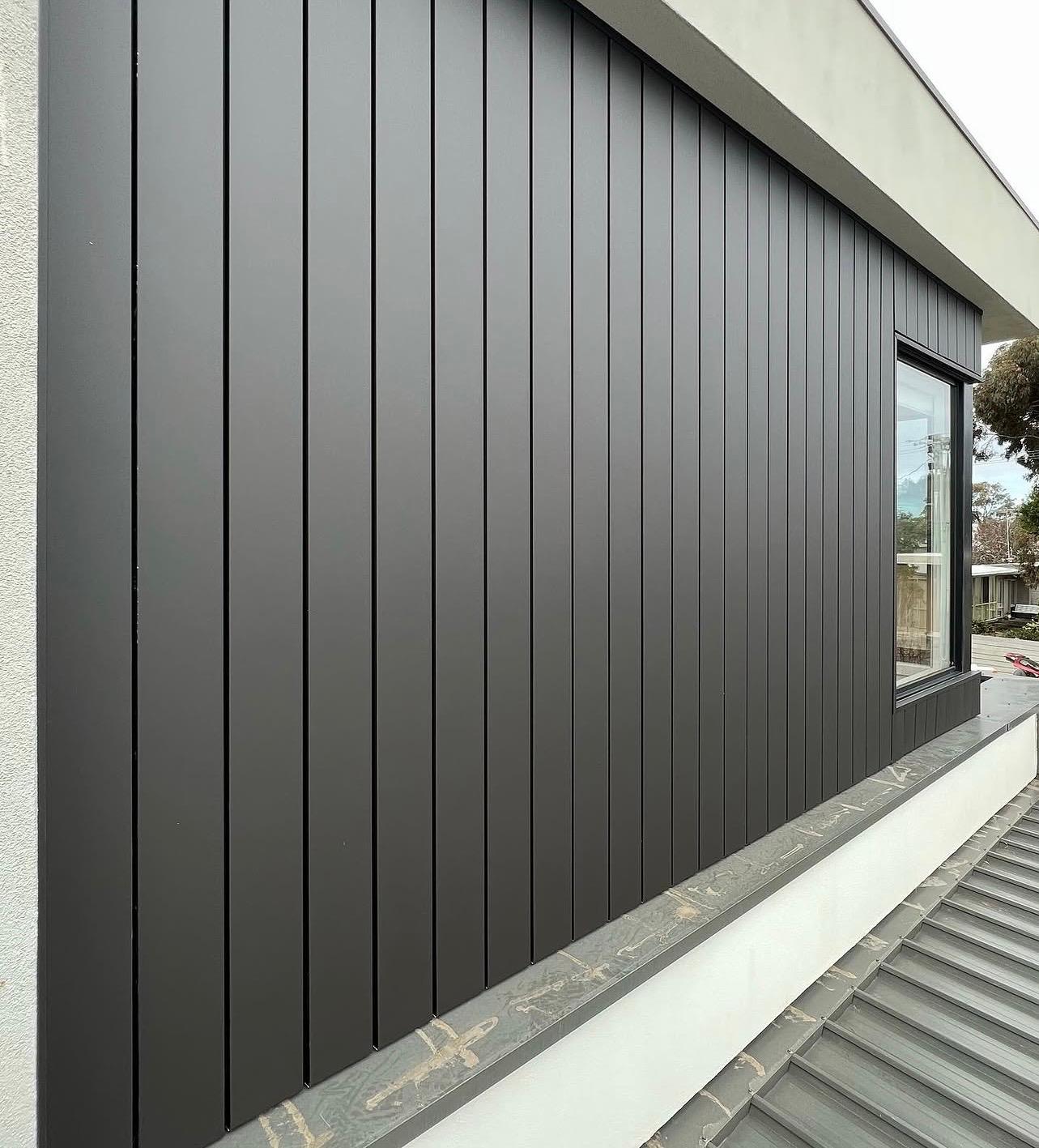 Matte black vertical cladding facade